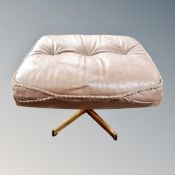 A burgandy leather swivel footstool CONDITION REPORT: faded - as found