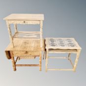 A light oak occasional table fitted a drawer and two further pieces of light oak furniture