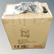 An electric heater in the form of a stove in original box.