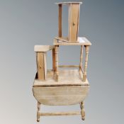 A light oak drop leaf table,