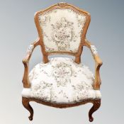 A pair of continental walnut tapestry upholstered armchairs