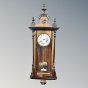 An antique mahogany and beech cased 8 day wall clock.