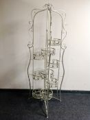 A metal folding multi-tier plant stand