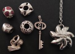 Jimmy Choo necklace and a collection of silver charms (Silver tested, two hallmarked weighing 15.