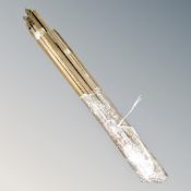 A quantity of antique brass stair rods.