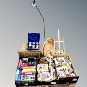 A pallet containing an antique brass embossed slipper box, antique guides, china ornaments,