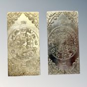 Two Chinese white metal ingots.