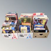 Three boxes of assorted board games and jigsaws