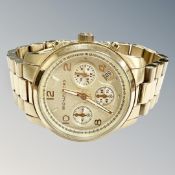 A Michael Kors gold plated wrist watch