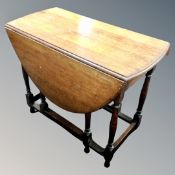 An Edwardian oak gateleg table