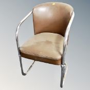 A mid century brown vinyl tubular metal tub armchair