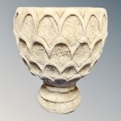 A concrete garden planter on stand