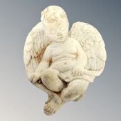 A concrete garden figure - cherub