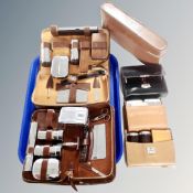 A tray containing six vintage cased gent's travel brush sets.