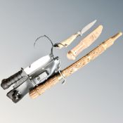 A deer's hoof-handled hunting knife in leather sheath together with a further hunting knife in