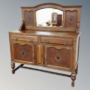 An Edwardian oak mirror backed sideboard