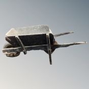 A vintage wooden wheel barrow