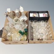 Two boxes containing a quantity of assorted drinking glasses, decanters, jug, biscuit barrels etc.