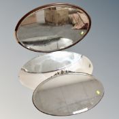 Two 1930s frameless bevelled edge mirrors together with a further antique framed mirror (af).