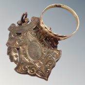 A 9 carat gold wedding band together with a plated watch fob