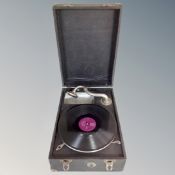 A portable table top vintage gramophone