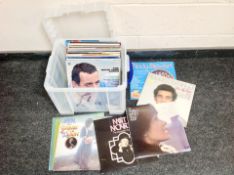 A lidded storage box containing vinyl records, easy listening.