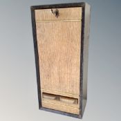 A vintage cigarette vending machine with key.