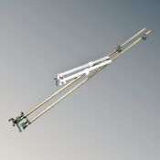 Two oversized metal clamps together with a pair of Axminster clamps