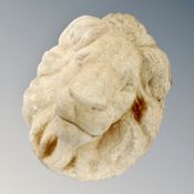 A concrete lion mask wall plaque
