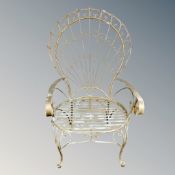 A wrought metal peacock armchair
