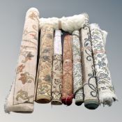 A crate of nine assorted rugs