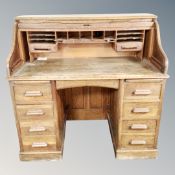 An Edwardian oak roll top desk