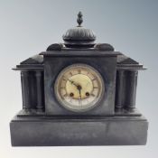 A Victorian black slate mantel clock.