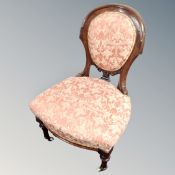 A Victorian mahogany nursing chair.