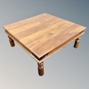 A Sheesham wood coffee table.