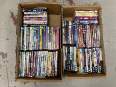 Two boxes of DVDs - approximately 100.
