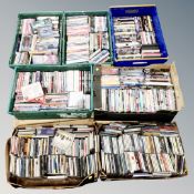A pallet of seven boxes containing assorted DVDs and CDs.