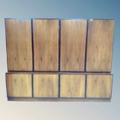 A 20th century Danish twin section double door cabinet on stand, fitted shelves.