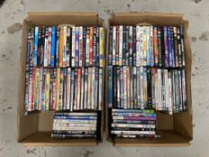 Two boxes of DVDs - approximately 100.