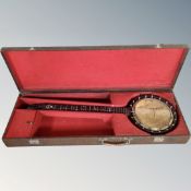 A six-string long neck banjo in case.