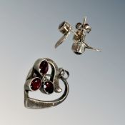 A vintage silver pendant and pair of earrings
