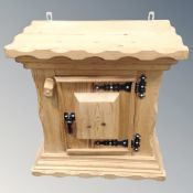 A Scandinavian pine rustic wall cabinet.