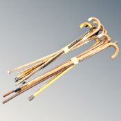 Two bundles containing vintage and later walking sticks.