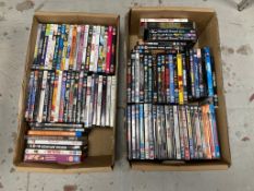 Two boxes of DVDs - approximately 100.