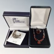 A boxed Charles Rennie Mackintosh silver crescent moon brooch together with a silver and Baltic