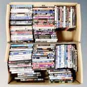Two boxes containing approximately 100 dvds