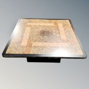 A 20th century square topped coffee table designed by Rolf Middelboe for Tranekær