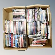 Two boxes containing approximately 100 dvds