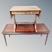 A Scandinavian sofa coffee table with two drawers on brass capped feet and a further coffee table