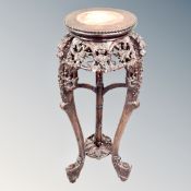 A Chinese carved padouk wood plant stand with inset rouge marble panel, height 95 cm,